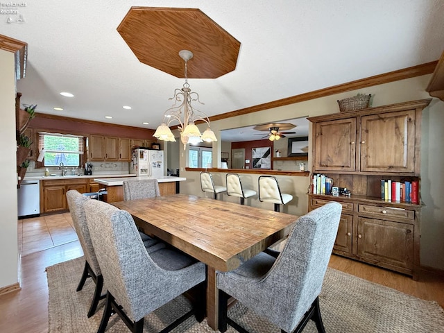 38 N Tecumseh Trl, Tiffin, OH 44883 - dining room featuring crown molding, ceiling fan, recessed lighting, light wood-style flooring, and a chandelier