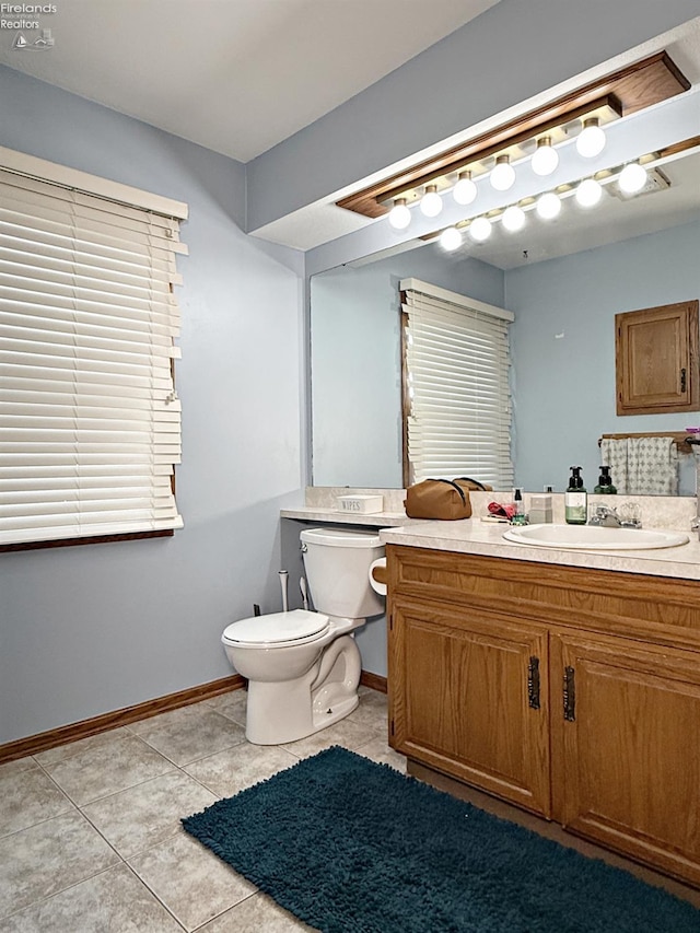 38 N Tecumseh Trl, Tiffin, OH 44883 - bathroom with toilet, tile patterned flooring, vanity, and baseboards