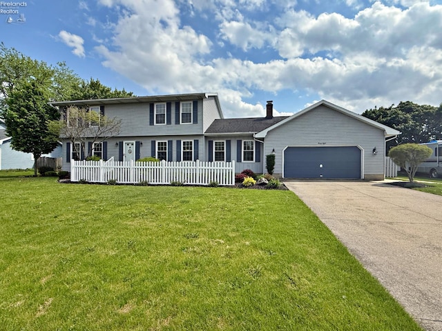 38 N Tecumseh Trl, Tiffin, OH 44883 - view of front of home featuring driveway and a garage