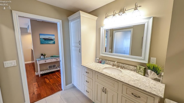 3088 N Marina View Dr Unit 12, Port Clinton, OH 43452 - bathroom with vanity, baseboards, and wood finished floors