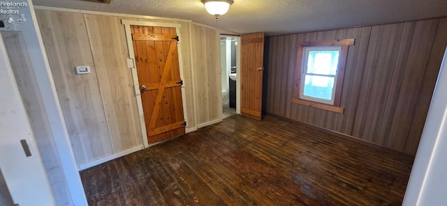 1037 Fishlock Ave, Findlay, OH 45840 - empty room with wood finished floors, wood walls, and a textured ceiling