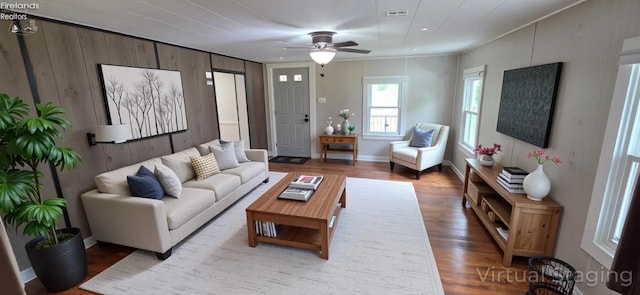 1037 Fishlock Ave, Findlay, OH 45840 - living area featuring wood finished floors, a ceiling fan, wood walls, crown molding, and recessed lighting
