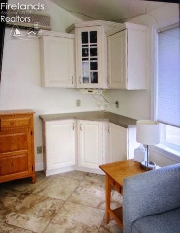 720 S Myrtle Ave, Willard, OH 44890 - kitchen featuring white cabinets and vaulted ceiling