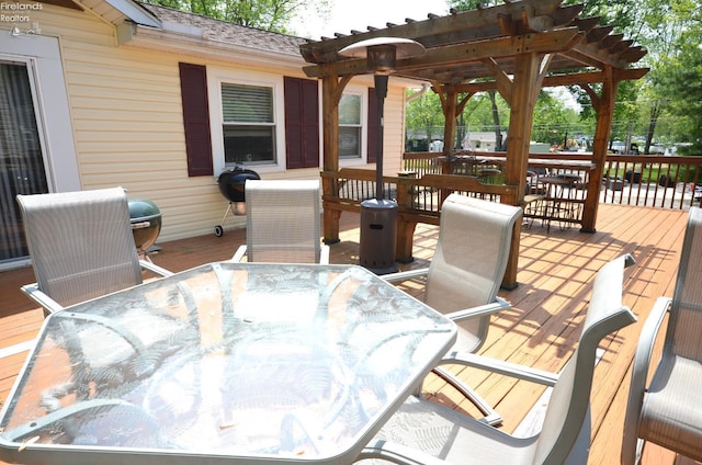 765 Riverside, Vermilion, OH 44089 - wooden deck with outdoor dining area and a pergola