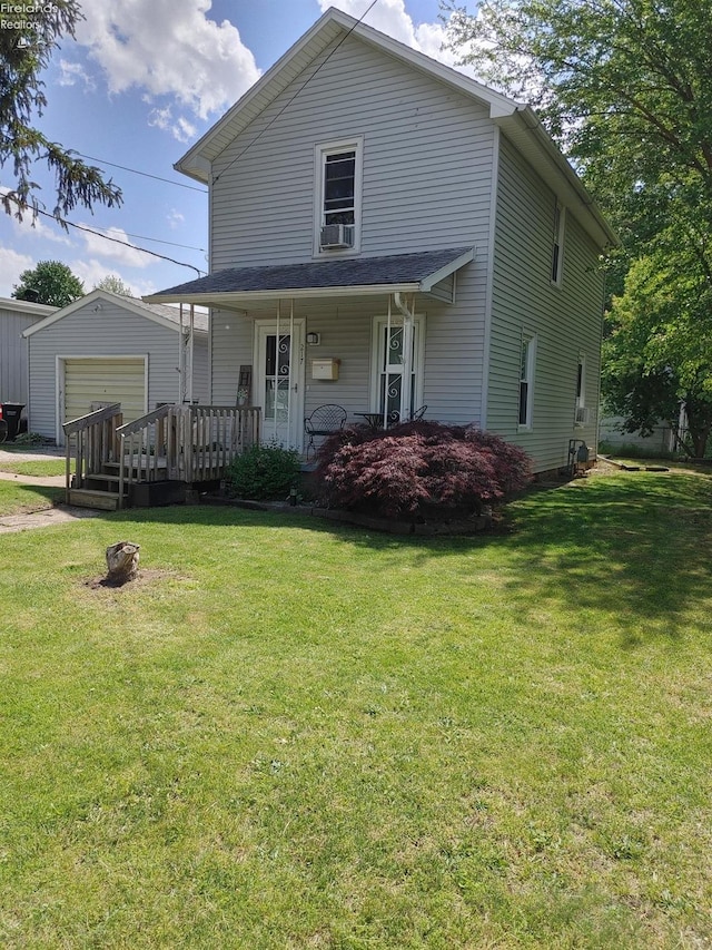 217 N Mulberry St, Clyde, OH 43410 - view of front of house with an outbuilding and a front lawn