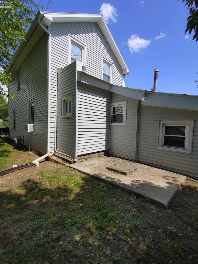 217 N Mulberry St, Clyde, OH 43410 - back of house featuring a patio and cooling unit