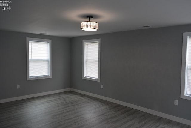 26 Marshall St, Norwalk, OH 44857 - unfurnished room with dark wood-style floors and baseboards