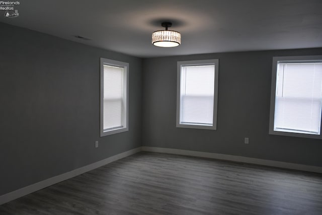 26 Marshall St, Norwalk, OH 44857 - unfurnished room with dark wood finished floors and baseboards