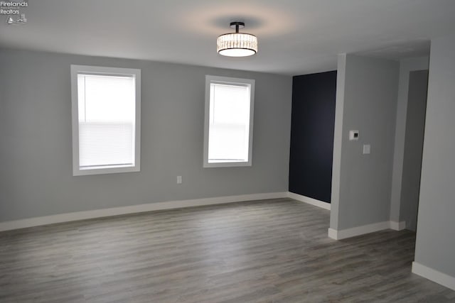 26 Marshall St, Norwalk, OH 44857 - empty room featuring baseboards and wood finished floors