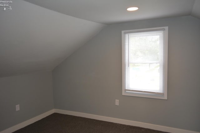 26 Marshall St, Norwalk, OH 44857 - additional living space featuring lofted ceiling, baseboards, dark carpet, and recessed lighting