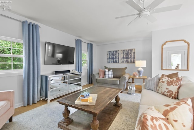 625 Laurel Ave, Port Clinton, OH 43452 - living room with wood finished floors, a ceiling fan, and baseboards