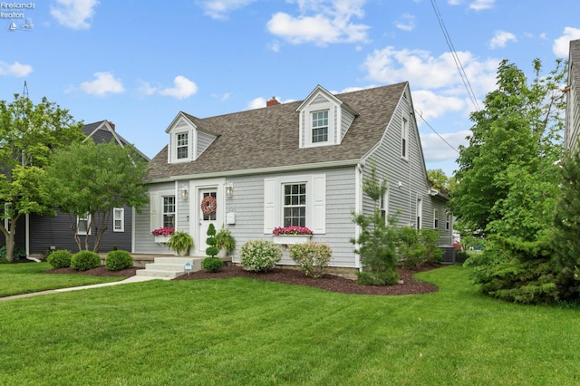 625 Laurel Ave, Port Clinton, OH 43452 - cape cod house with a shingled roof, a front yard, and a chimney