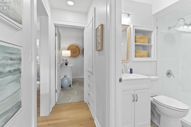 625 Laurel Ave, Port Clinton, OH 43452 - full bathroom with wood finished floors, vanity, toilet, and a shower