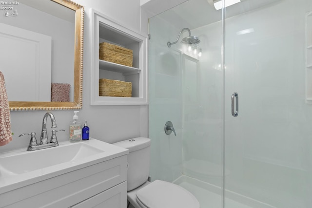 625 Laurel Ave, Port Clinton, OH 43452 - bathroom featuring a shower stall, toilet, and vanity
