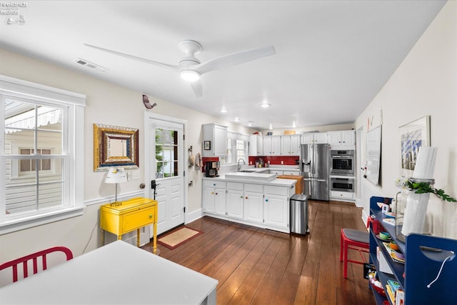 236 Elm Ave, Lakeside, OH 43440 - kitchen with appliances with stainless steel finishes, a sink, white cabinets, light countertops, and recessed lighting