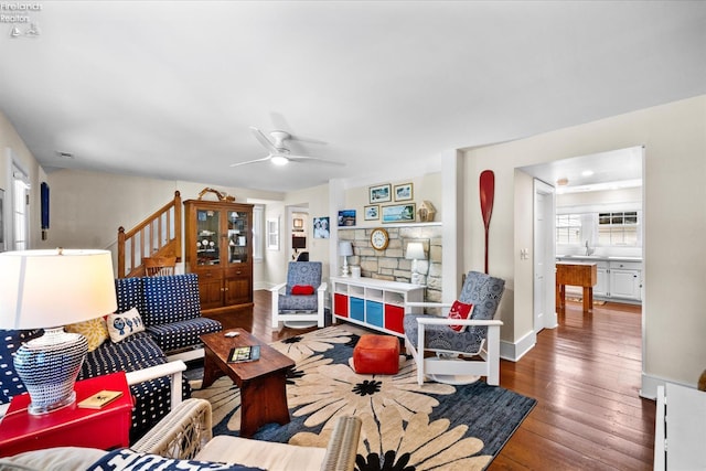 236 Elm Ave, Lakeside, OH 43440 - living room featuring wood-type flooring, a ceiling fan, baseboards, and stairway