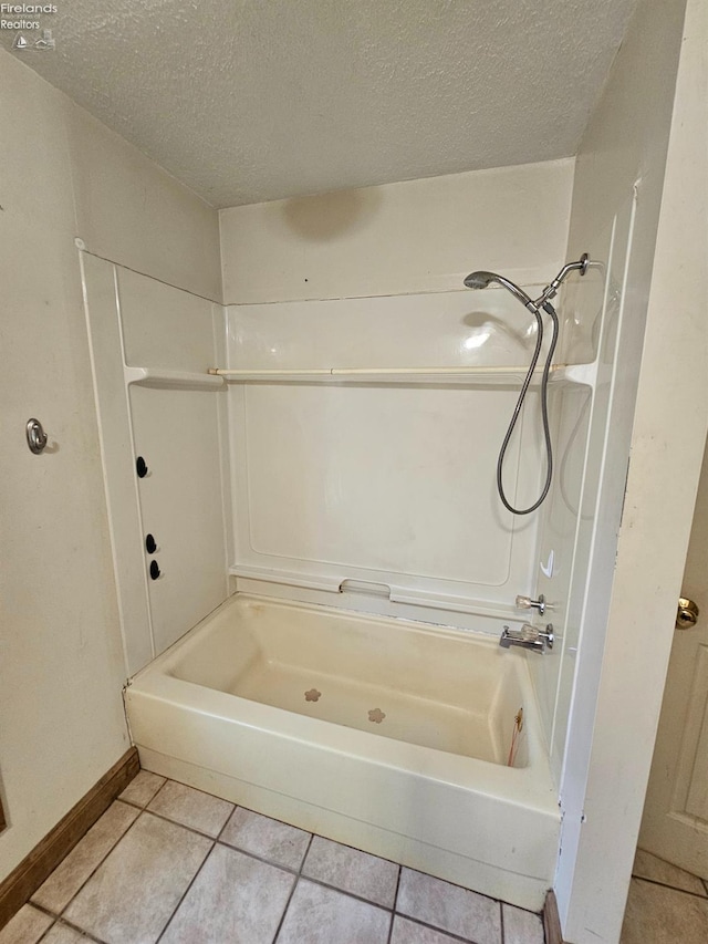 202 Duane St, Clyde, OH 43410 - full bathroom with a textured ceiling, tile patterned floors, and baseboards