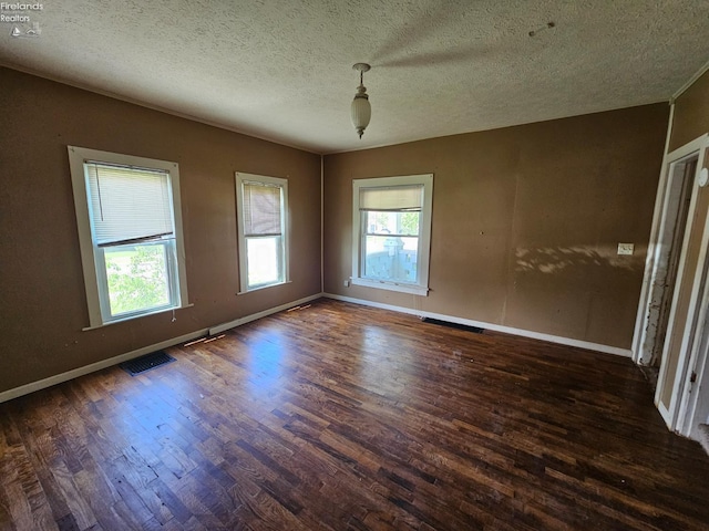 202 Duane St, Clyde, OH 43410 - unfurnished room with wood finished floors, a textured ceiling, and baseboards