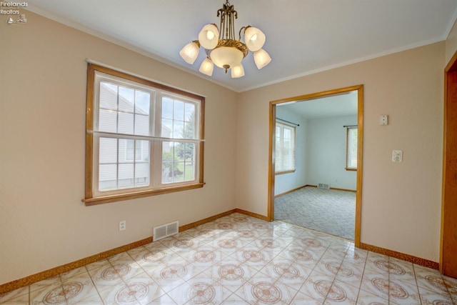419 Kinney St, Bellevue, OH 44811 - unfurnished room with a chandelier, baseboards, and ornamental molding
