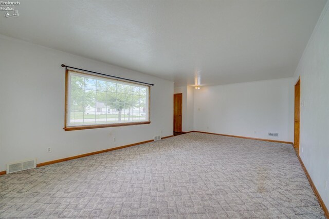 419 Kinney St, Bellevue, OH 44811 - empty room featuring carpet and baseboards