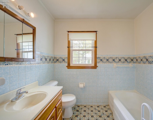 419 Kinney St, Bellevue, OH 44811 - full bath featuring a tub to relax in, toilet, a wainscoted wall, tile walls, and vanity