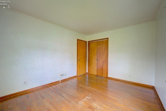 419 Kinney St, Bellevue, OH 44811 - spare room with baseboards and light wood-style floors