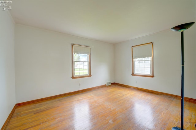 419 Kinney St, Bellevue, OH 44811 - spare room with plenty of natural light, wood finished floors, and baseboards