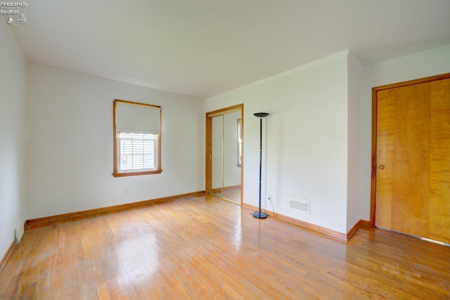 419 Kinney St, Bellevue, OH 44811 - spare room with wood finished floors and baseboards