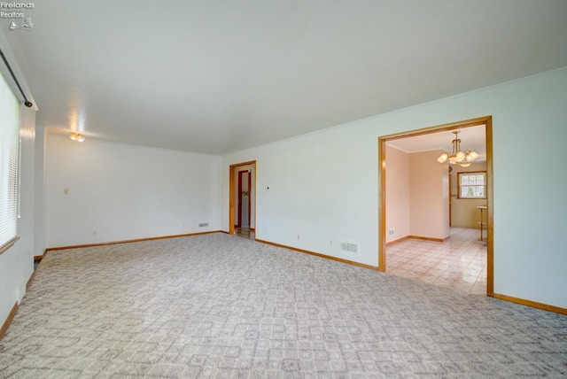 419 Kinney St, Bellevue, OH 44811 - spare room with a chandelier, carpet floors, and baseboards
