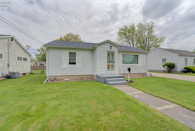 419 Kinney St, Bellevue, OH 44811 - view of front of home with a front yard and central air condition unit