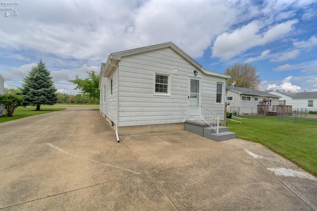 419 Kinney St, Bellevue, OH 44811 - rear view of house featuring a yard