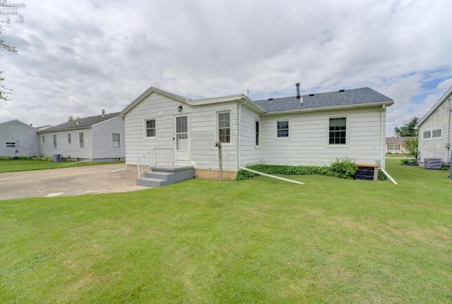 419 Kinney St, Bellevue, OH 44811 - rear view of house featuring a yard and cooling unit