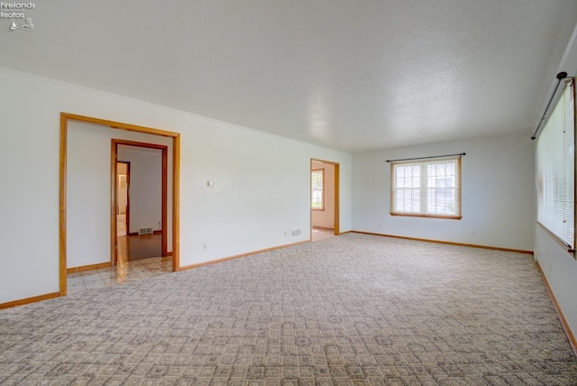 419 Kinney St, Bellevue, OH 44811 - carpeted empty room with baseboards and a textured ceiling