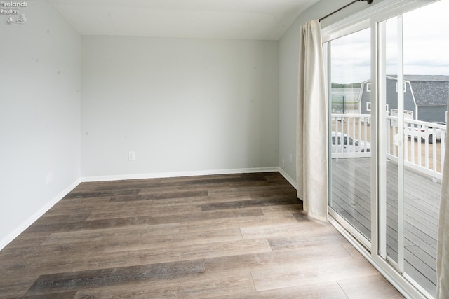6039 E Harbor Rd Unit 8, Marblehead, OH 43440 - empty room featuring wood finished floors and baseboards