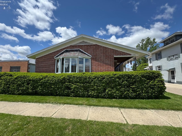 104 N Wood St, Fremont, OH 43420 - view of side of property featuring brick siding
