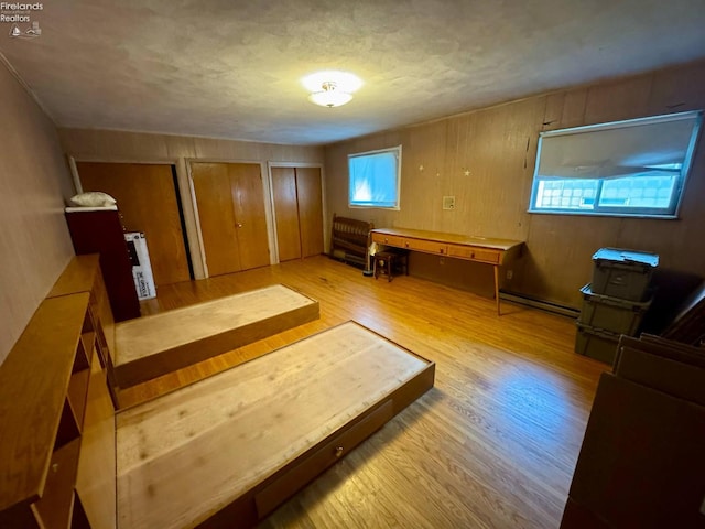 104 N Wood St, Fremont, OH 43420 - interior space featuring wood finished floors and a baseboard heating unit
