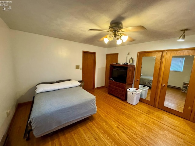 104 N Wood St, Fremont, OH 43420 - bedroom with light wood finished floors and a ceiling fan