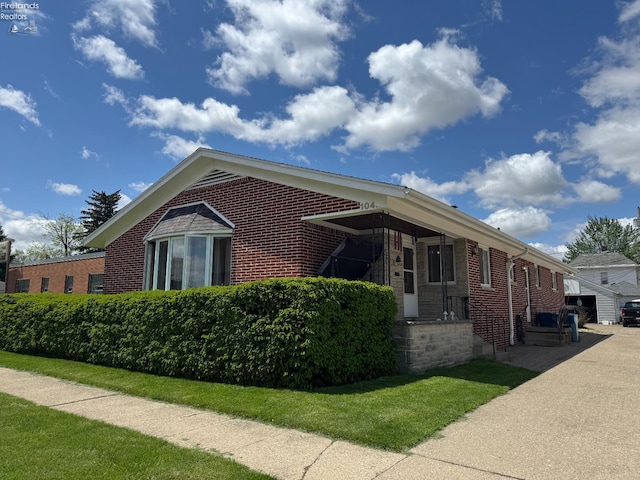 104 N Wood St, Fremont, OH 43420 - view of property exterior featuring brick siding