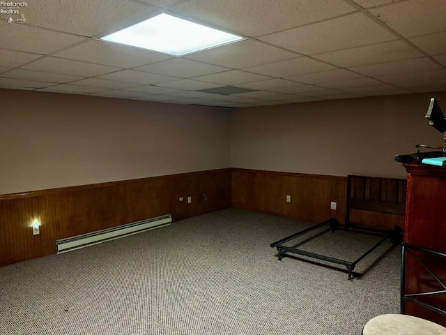 104 N Wood St, Fremont, OH 43420 - workout area with baseboard heating, wainscoting, a paneled ceiling, carpet flooring, and wooden walls