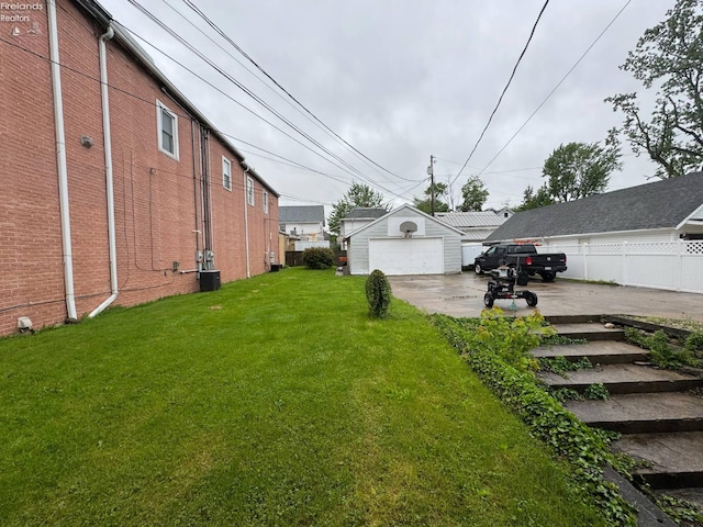 104 N Wood St, Fremont, OH 43420 - view of yard featuring a garage and driveway