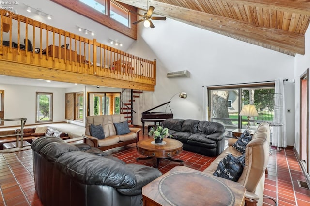 2203 Eagles Nest Cir, Sandusky, OH 44870 - living area featuring high vaulted ceiling, ceiling fan, beamed ceiling, stairway, and tile patterned floors