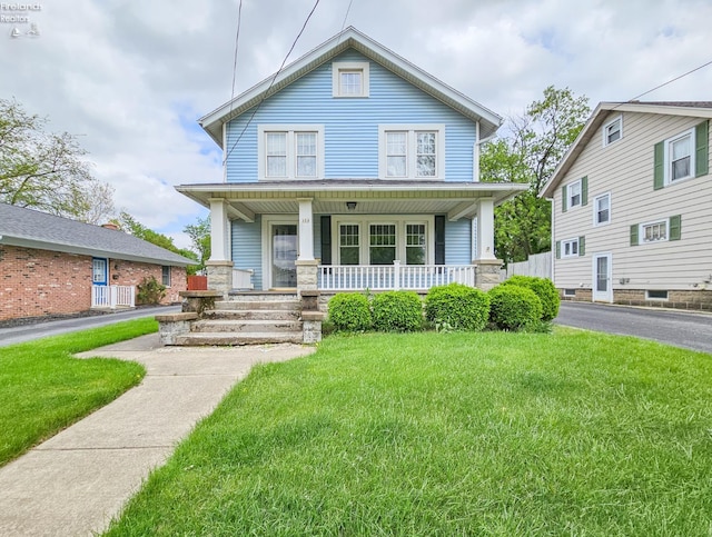 124 Walter St, Bellevue, OH 44811 - traditional style home with a porch and a front lawn