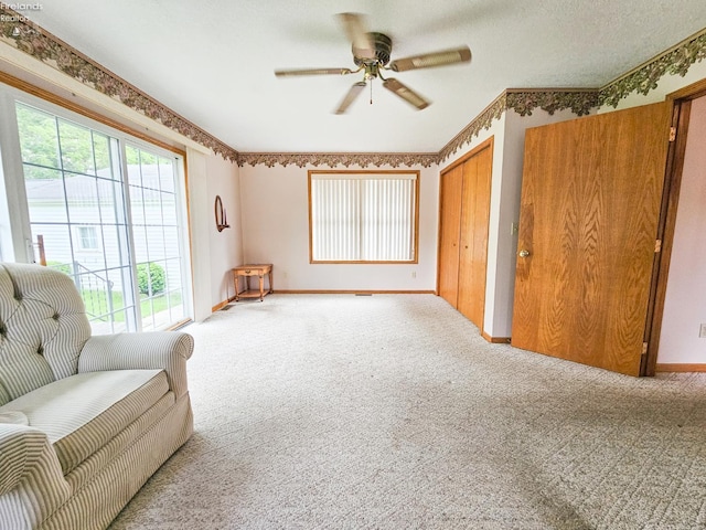 124 Walter St, Bellevue, OH 44811 - sitting room featuring light colored carpet, a ceiling fan, and baseboards