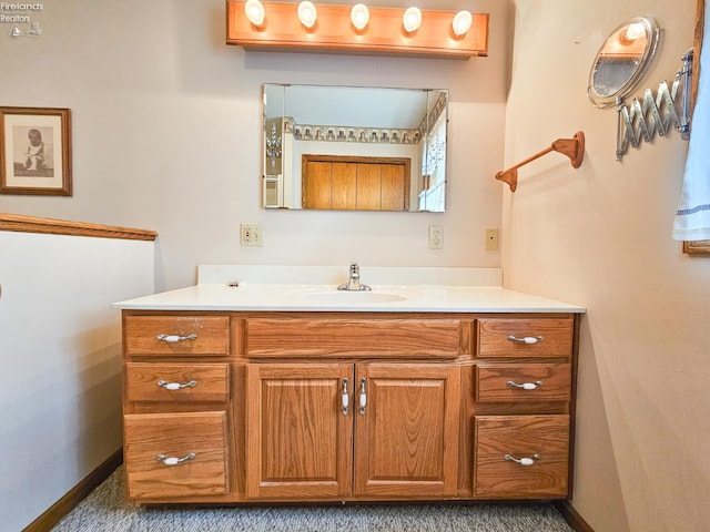 124 Walter St, Bellevue, OH 44811 - bathroom with vanity and baseboards