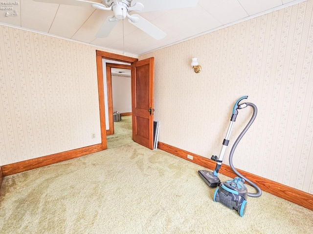 124 Walter St, Bellevue, OH 44811 - workout room featuring ornamental molding, ceiling fan, carpet floors, and baseboards