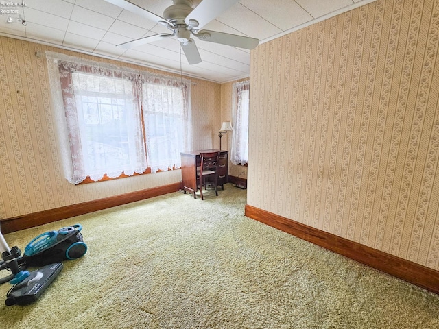 124 Walter St, Bellevue, OH 44811 - spare room featuring a ceiling fan, healthy amount of natural light, carpet floors, crown molding, and baseboards