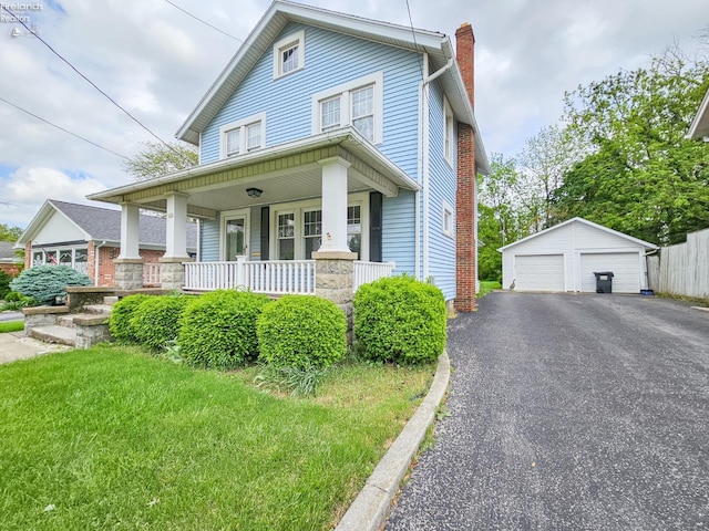 124 Walter St, Bellevue, OH 44811 - view of front of property featuring a garage, a chimney, a porch, and an outbuilding
