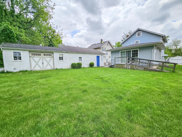 124 Walter St, Bellevue, OH 44811 - back of house featuring a yard and a deck