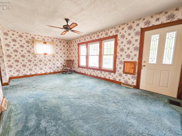 124 Walter St, Bellevue, OH 44811 - entrance foyer with wallpapered walls, a textured ceiling, carpet flooring, a ceiling fan, and baseboards