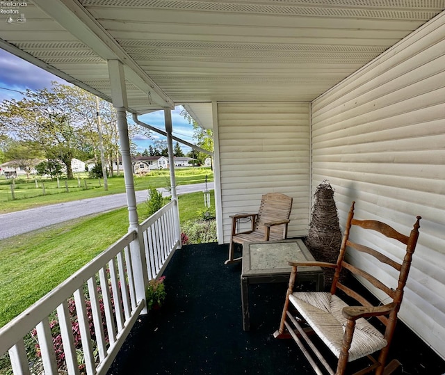 203 Washington St, Bettsville, OH 44815 - covered porch featuring a lawn
